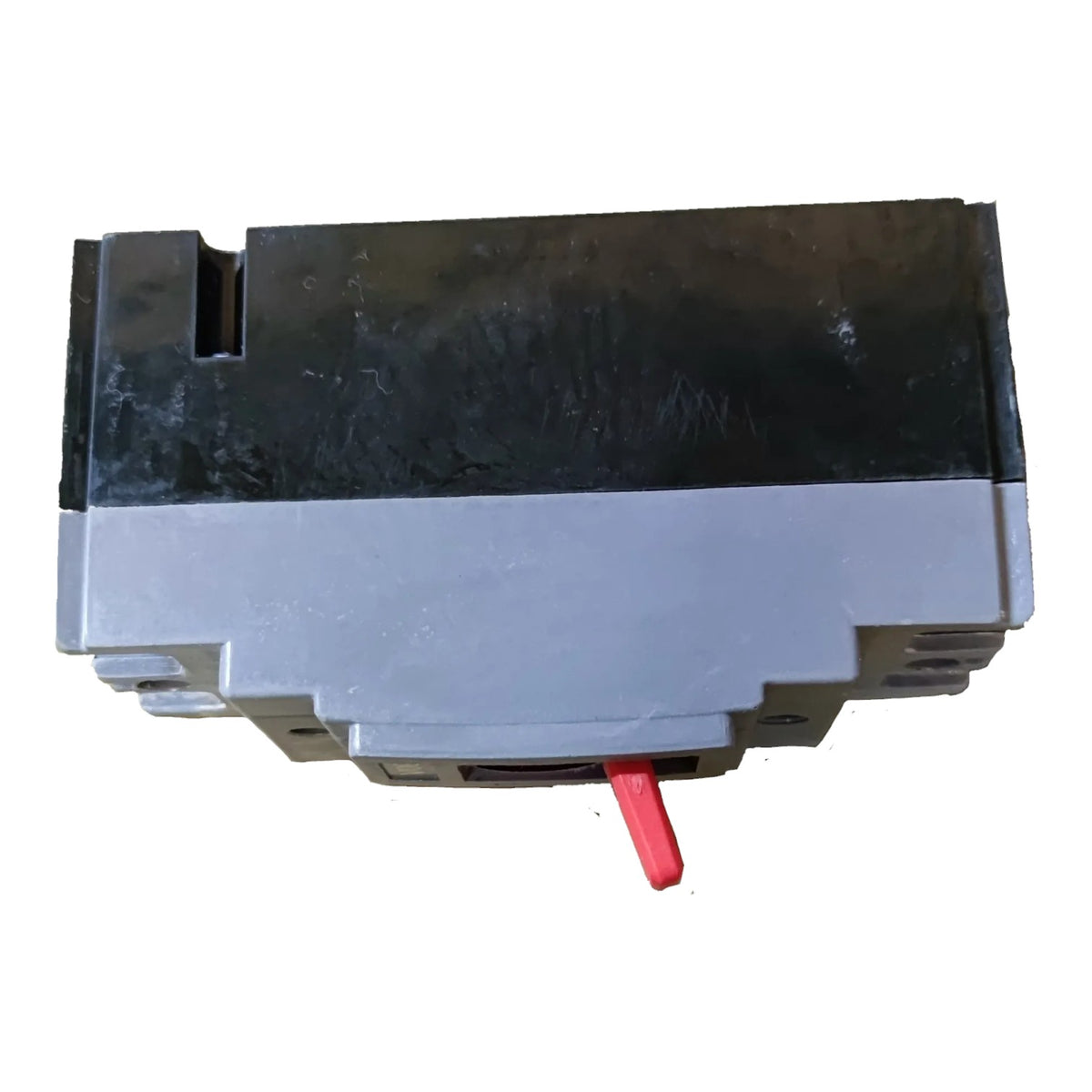 A gray and black industrial electrical component or switch module with a small red lever, shown on a plain white background.