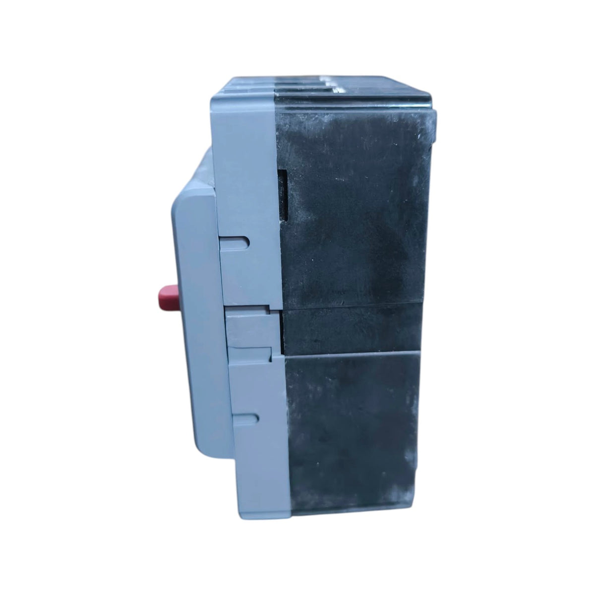 A gray electrical contactor or relay component with a red terminal button, shown from a side profile view against a plain white background.
