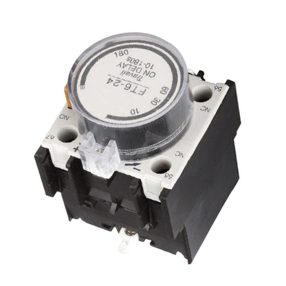 A small electrical delay timer relay component with a black plastic housing, white terminal markings, and a circular silver-gray dial cover on a plain white background.