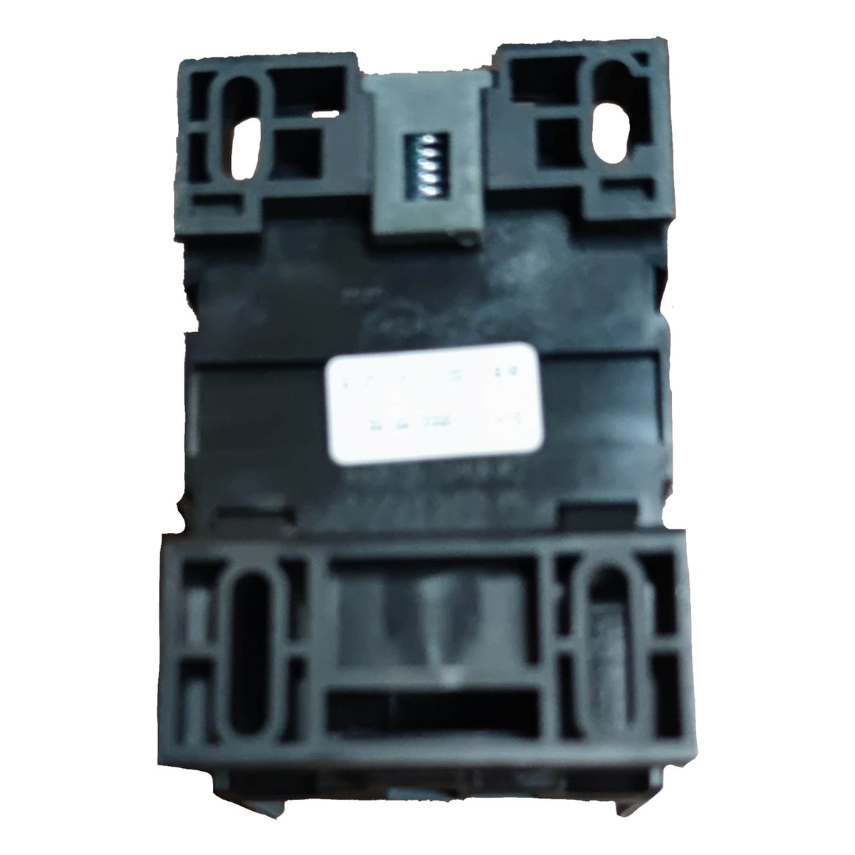 Black plastic component on a white background