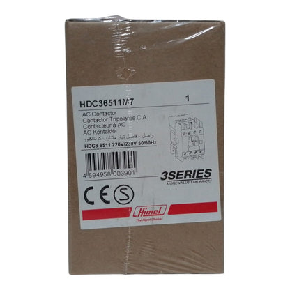 A brown cardboard box for a Himel 3Series AC Contactor, model HDC36511M7, wrapped in clear plastic and featuring a white label with barcode and product details.