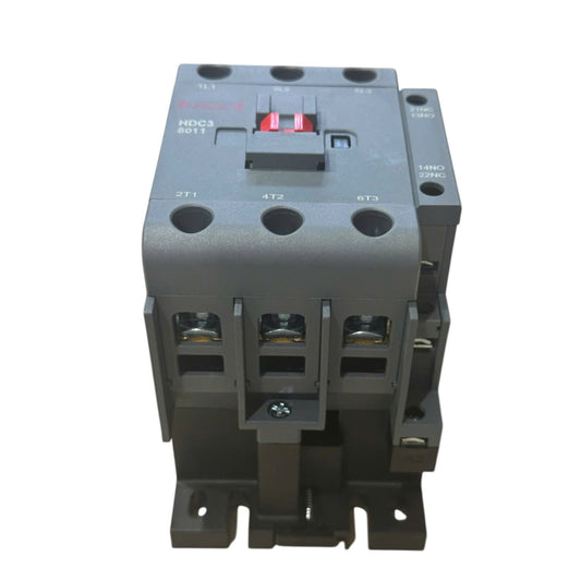 A dark gray industrial contactor relay with three main terminal blocks and a red switch, photographed on a solid white background.