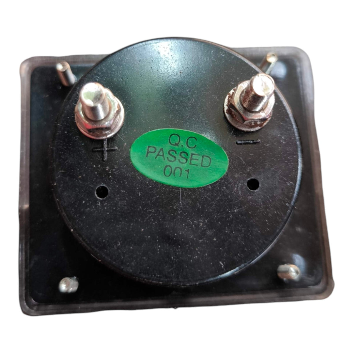 A square black electrical contactor or relay component with a round top plate, two metal terminal posts with nuts, and a green sticker reading 'Q.C PASSED 001' on a white background.