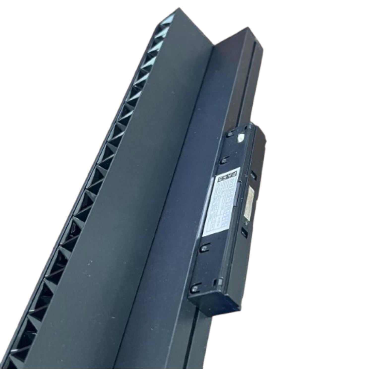 A close-up of a dark gray or black metal mounting bracket or frame component with a ribbed side and a small attached rectangular label or sensor, shown on a plain white background.