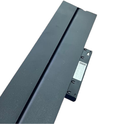 A long, dark gray metal track or channel with a small attached black bracket and a white product label, photographed on a plain white background.