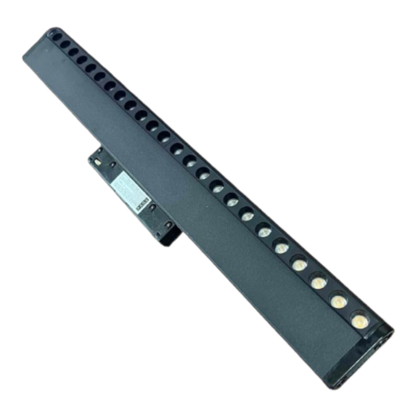 A long, narrow black electronic component or battery accessory with multiple circular openings and a small attached label, shown on a plain white background.