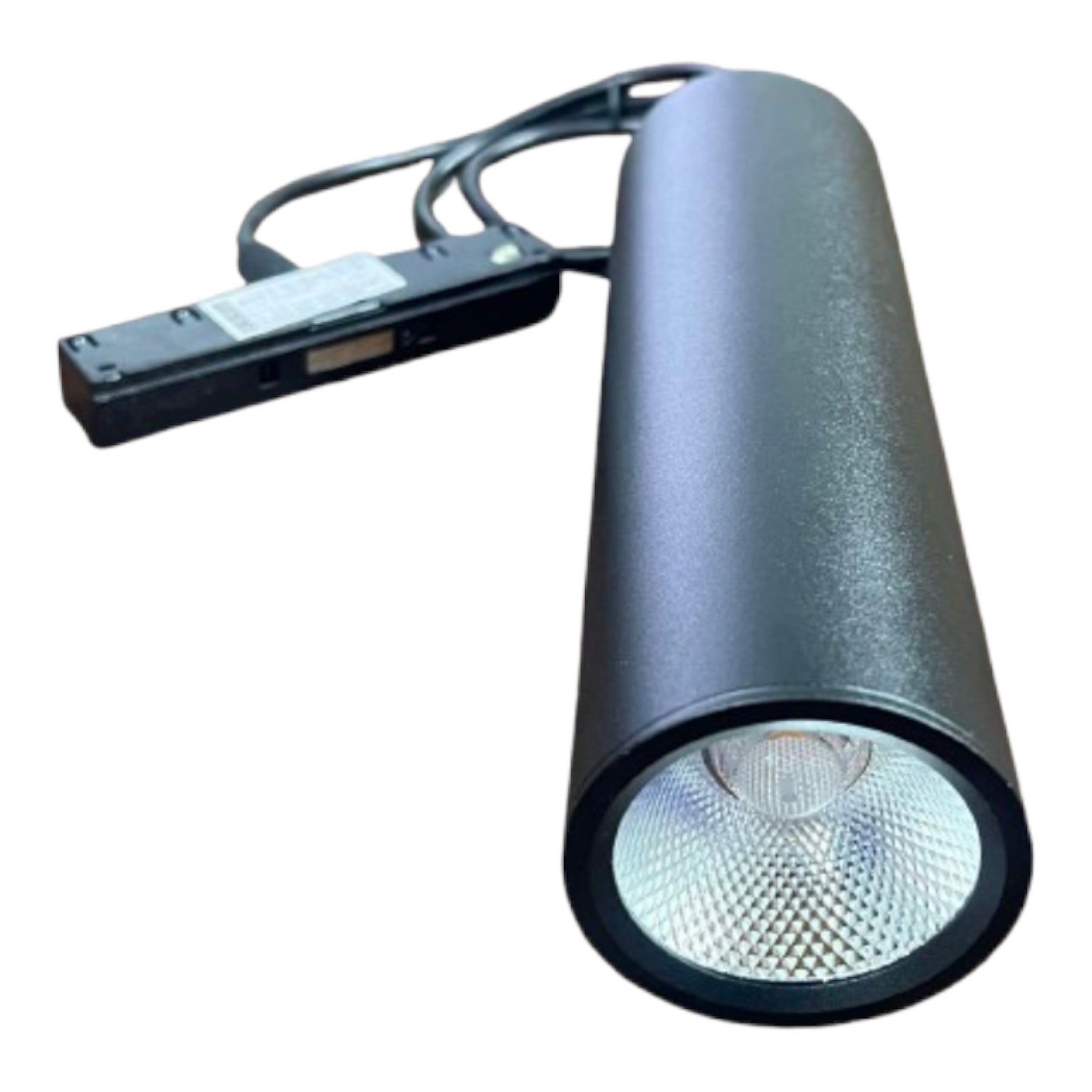 A black cylindrical LED spotlight with a textured finish, featuring a clear lens on the front and an attached black power cable with a rectangular connector, shown against a plain white background.