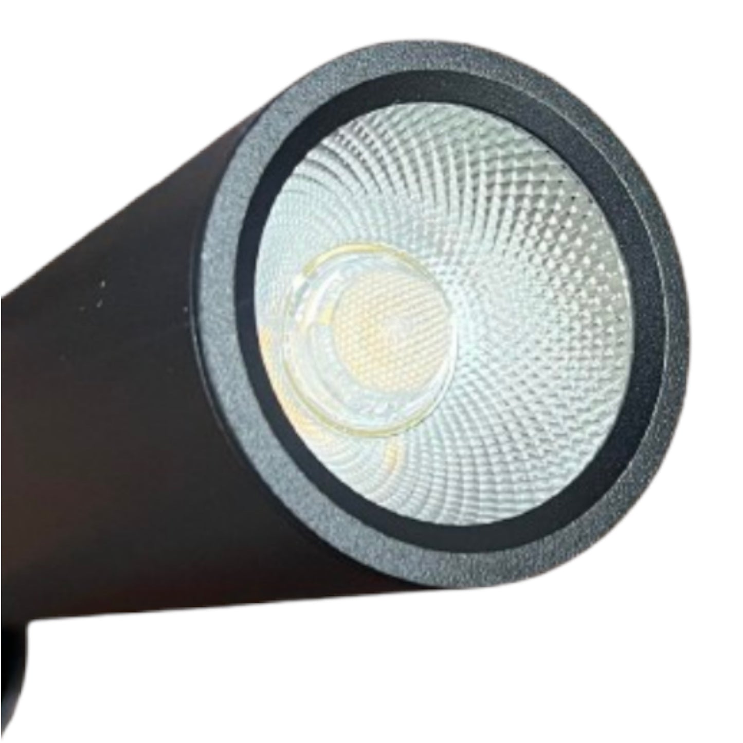 Close-up of a black cylindrical LED spotlight or lamp head with a textured clear lens and visible warm yellow LED chip, isolated on a white background.