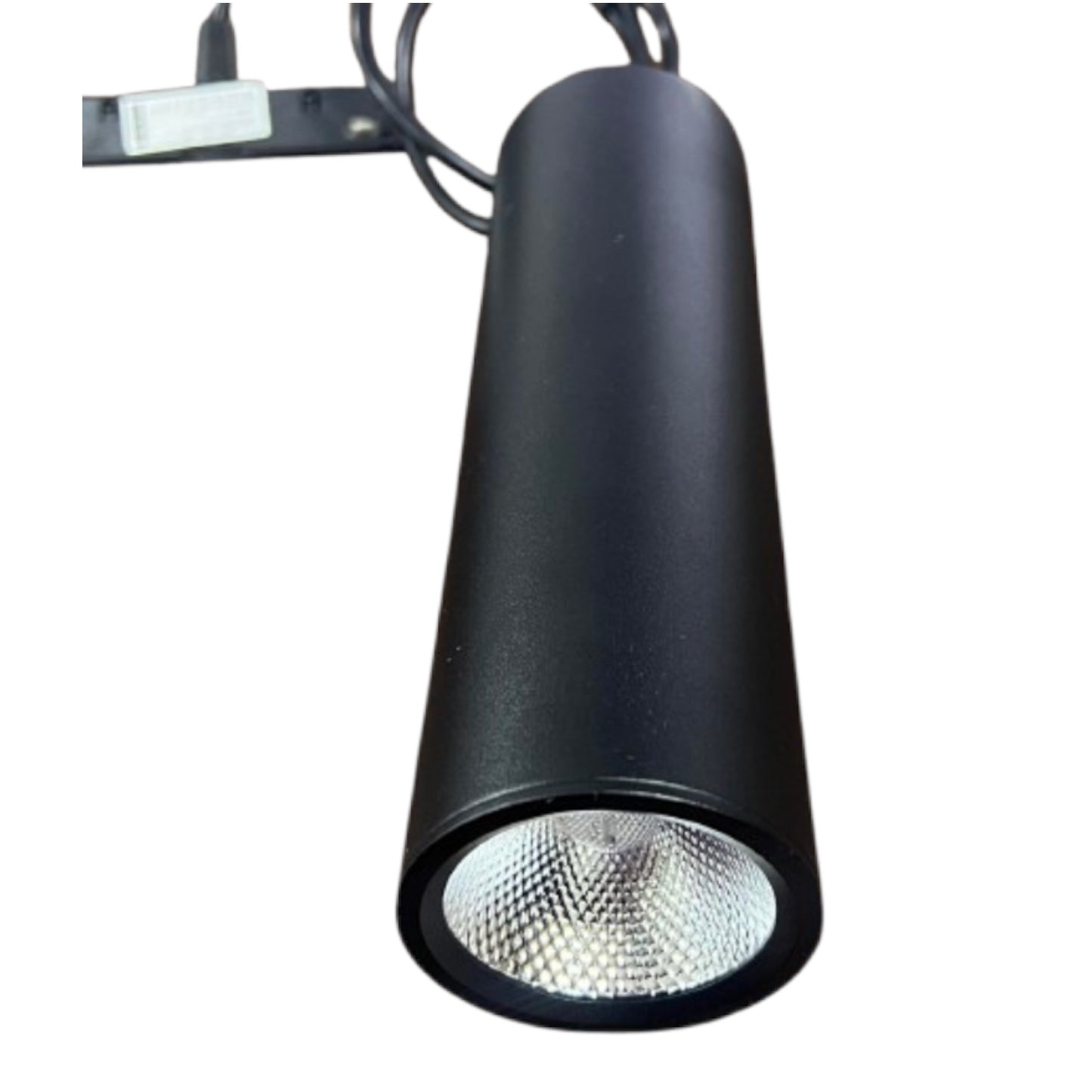 A matte black cylindrical track spotlight with a silver reflective interior, shown with its mounting bracket and wire on a plain white background.