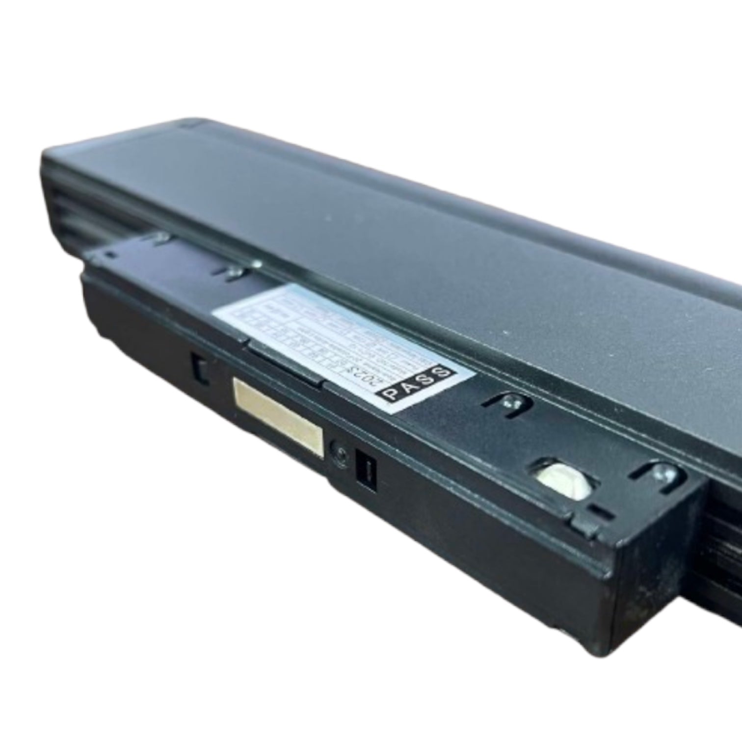 A black rectangular laptop battery with a white specification label, shown at an angle on a plain white background.