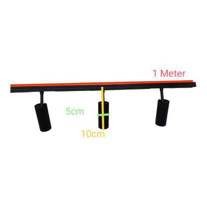 Black linear track lighting fixture with two adjustable cylindrical spotlights, overlaid with dimension labels showing 1 Meter track length, 5 cm head width, and 10 cm head depth on a white background.