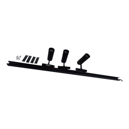 A black three-light linear track spotlight fixture with three adjustable cylindrical heads, shown with mounting brackets and a small silver hardware piece on a plain white background.