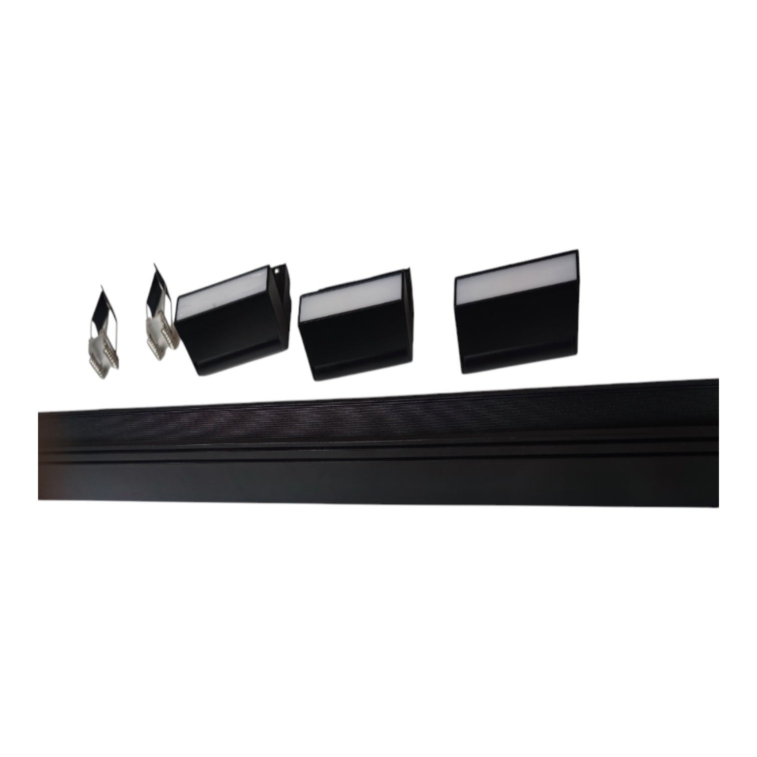 Four black rectangular light fixtures with silver metal backings are shown above a long black mounting rail on a plain white background.
