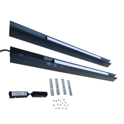 A pair of long black linear LED light bars with a white light-emitting strip, shown with mounting brackets, a small black control module, and screws on a plain white background.