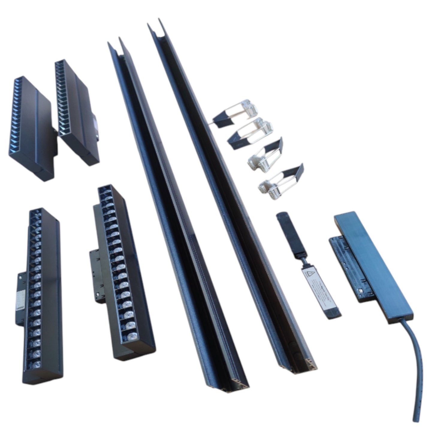 A set of black metal track or channel profiles with multiple mounting brackets, clips, and hardware pieces arranged on a plain white background.