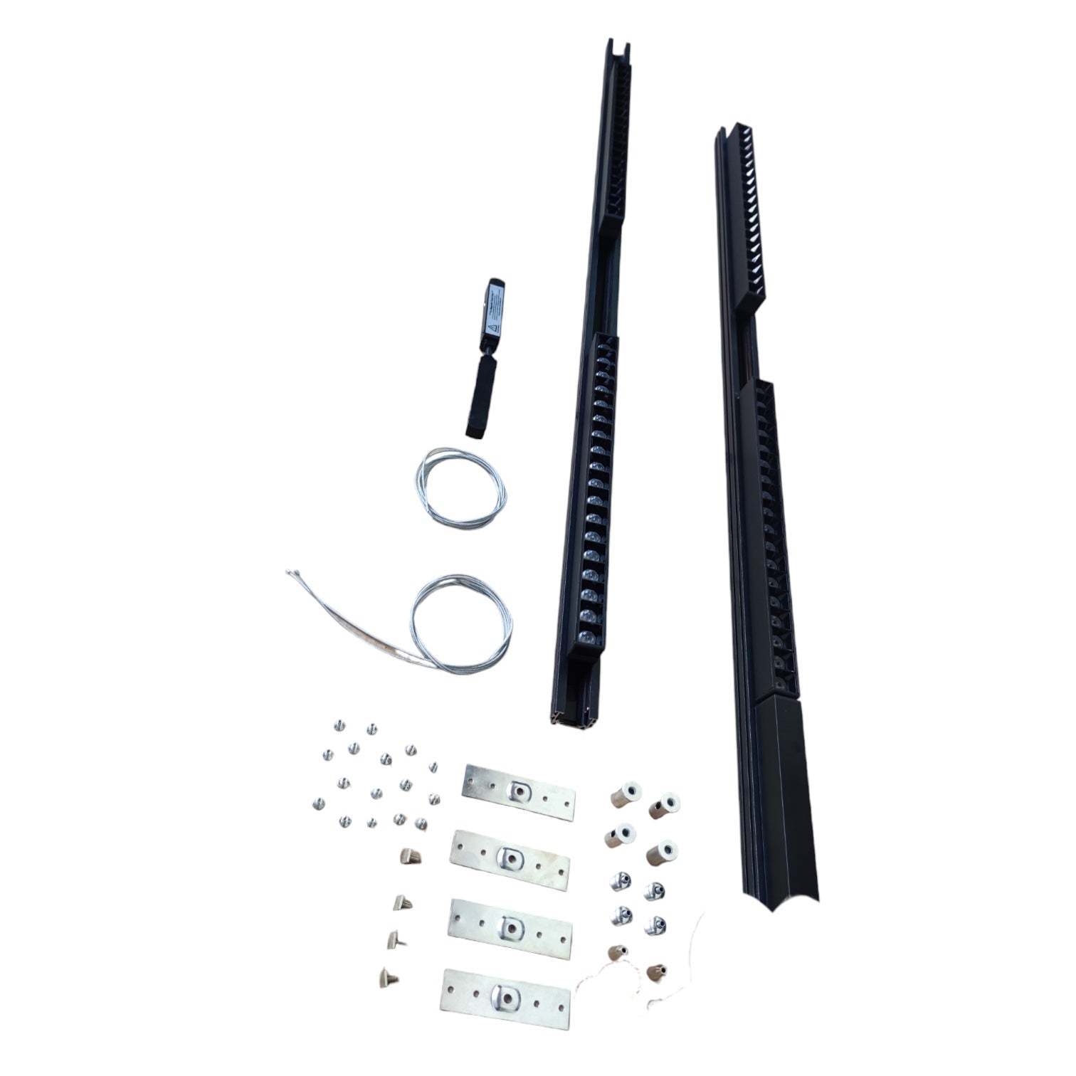 A hardware installation kit containing two long black metal rails, silver mounting brackets, screws, washers, and a small black-handled tool, arranged on a plain white background.