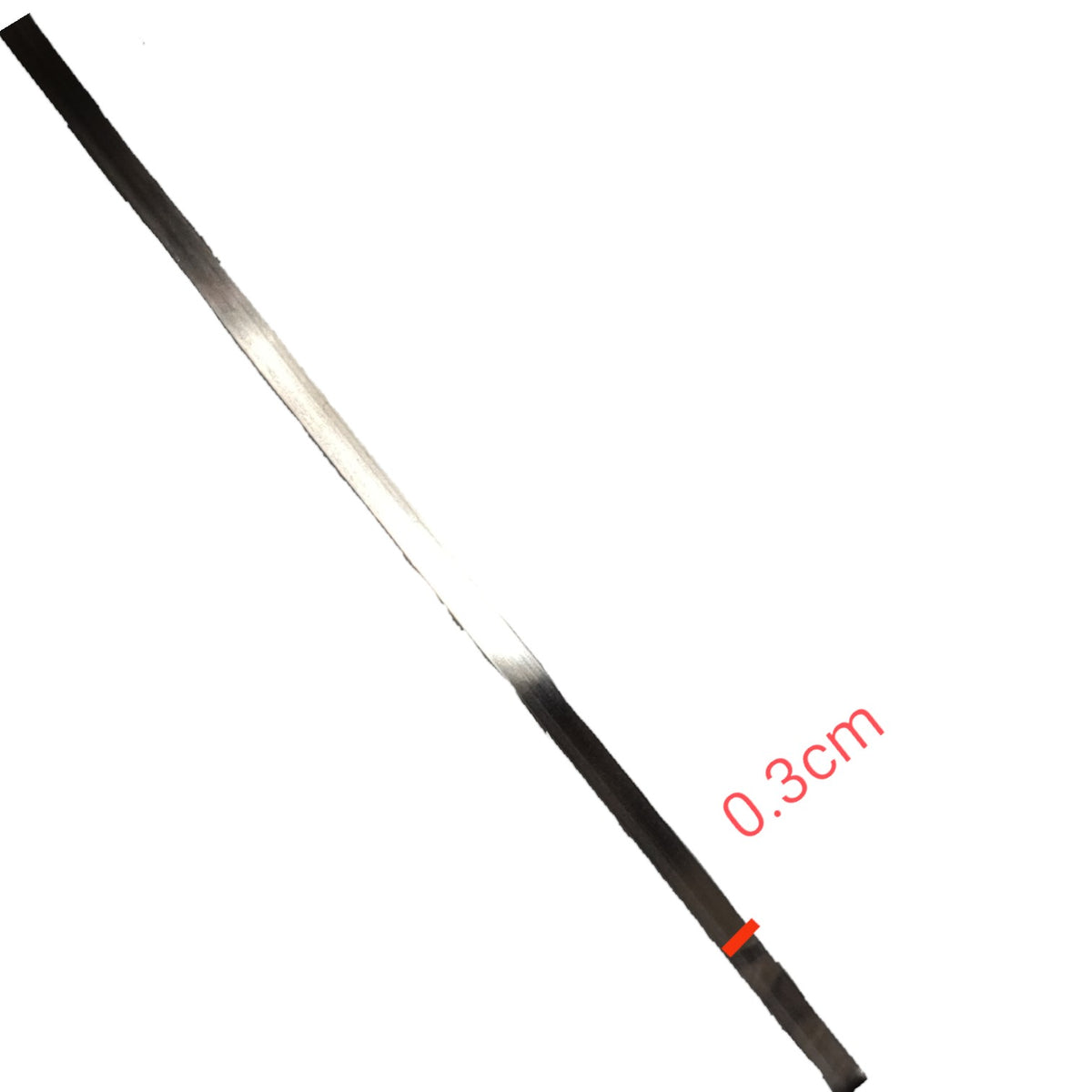 A close-up of a thin black strip or ribbon shown diagonally on a white background, with a red measurement label reading 0.3cm.