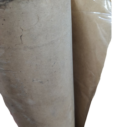 Close-up of a roll of brown paper with a white background