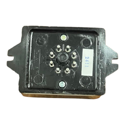 A black plastic electronic control module or sensor with multiple silver screw terminals and a white sticker labeled '2411' on the side, shown against a plain white background.