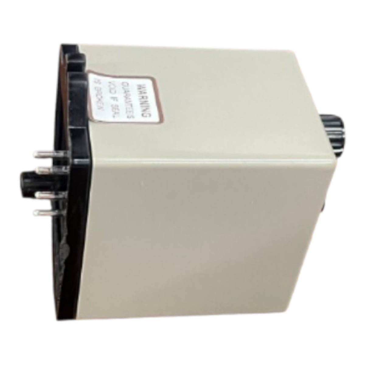 A small rectangular electronic module or box with a beige body, black side panel, and visible terminal connectors on the left, photographed on a plain white background.