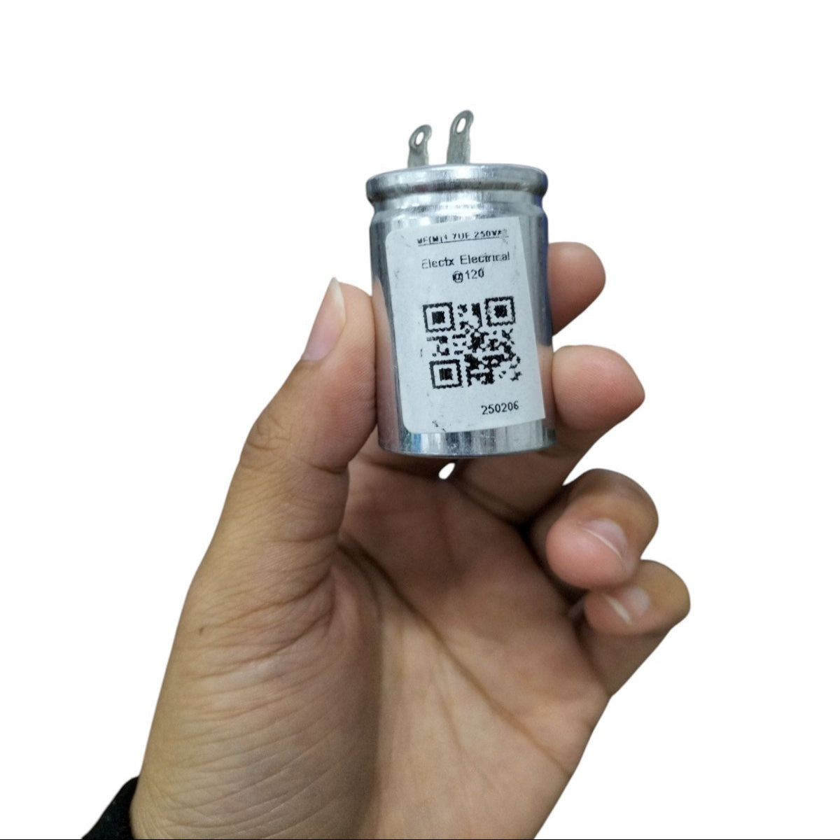 250V AC motor running capacitor in hand with silver casing and QR code label for electrical applications