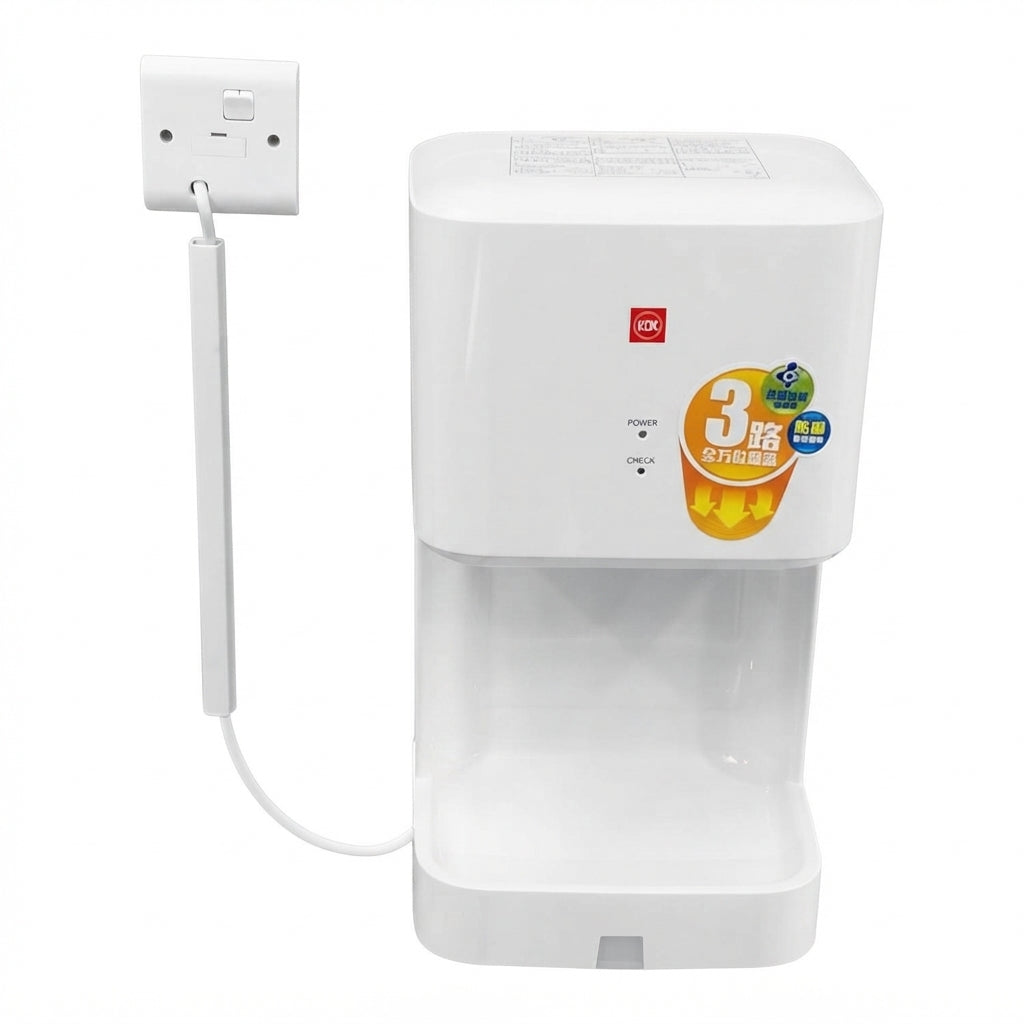 A white countertop electric kettle with a transparent water reservoir and a power cord plugged into a wall outlet, shown on a plain white background.