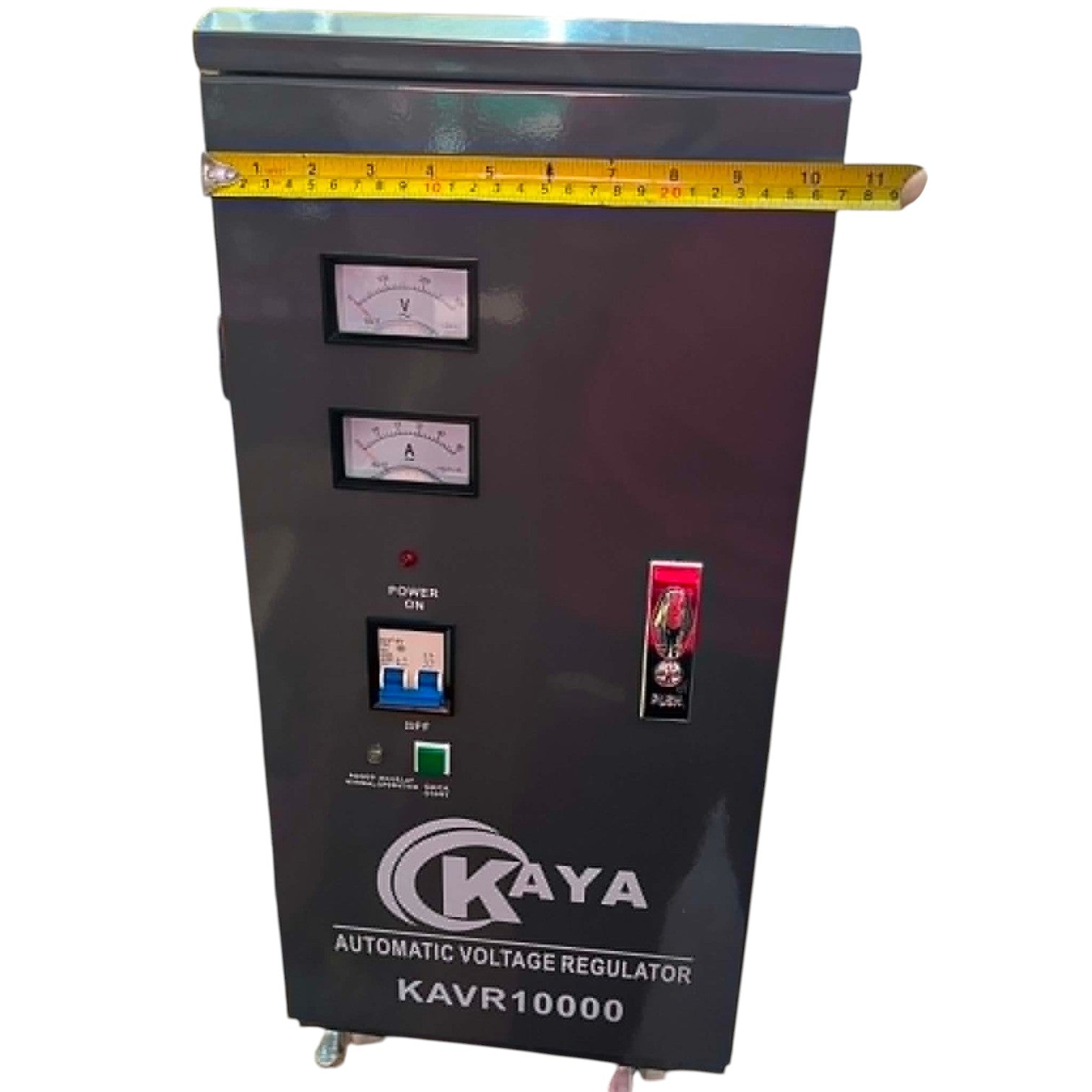 Kaya automatic voltage regulator with a measuring tape for scale on a white background