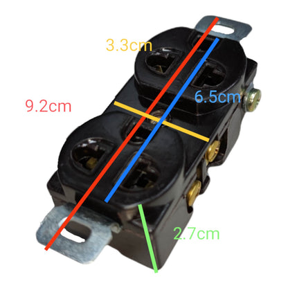 Black double outlet electrical socket with metal mounting tabs, overlaid with colored measurement lines and labels showing dimensions in centimeters on a white background.