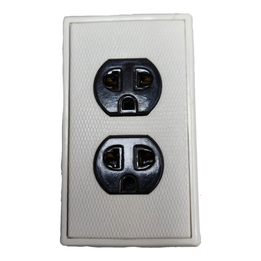 A white textured double outlet electrical wall plate with black sockets, shown against a plain white background.
