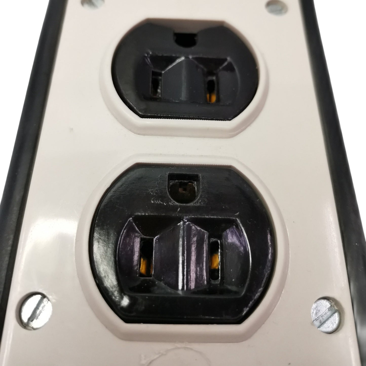 Close-up of a power outlet with two sockets on a white background