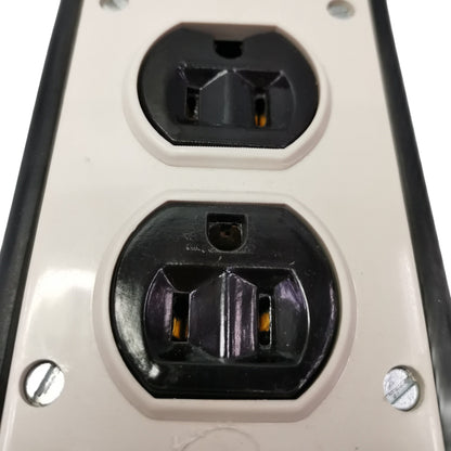 Close-up of a power outlet with two sockets on a white background