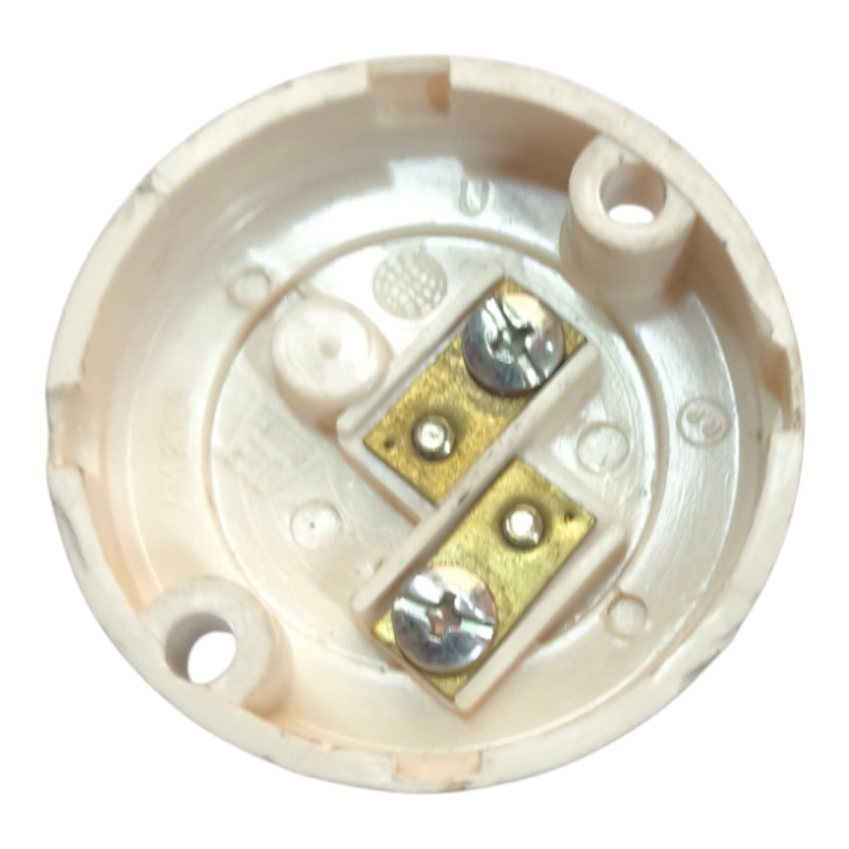 An off-white plastic socket cover with two brass screw terminals and silver screws, shown against a plain white background.