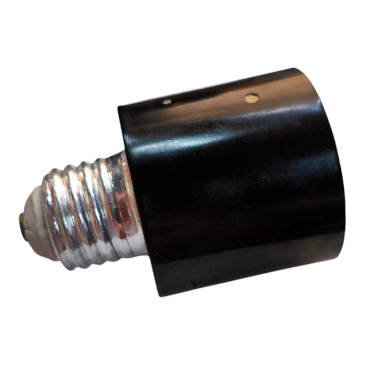 A black cylindrical lamp holder or socket with a silver screw base, isolated on a white background.