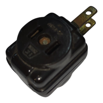 A black plastic electrical outlet switch with a single brass-colored terminal, shown on a plain white background.