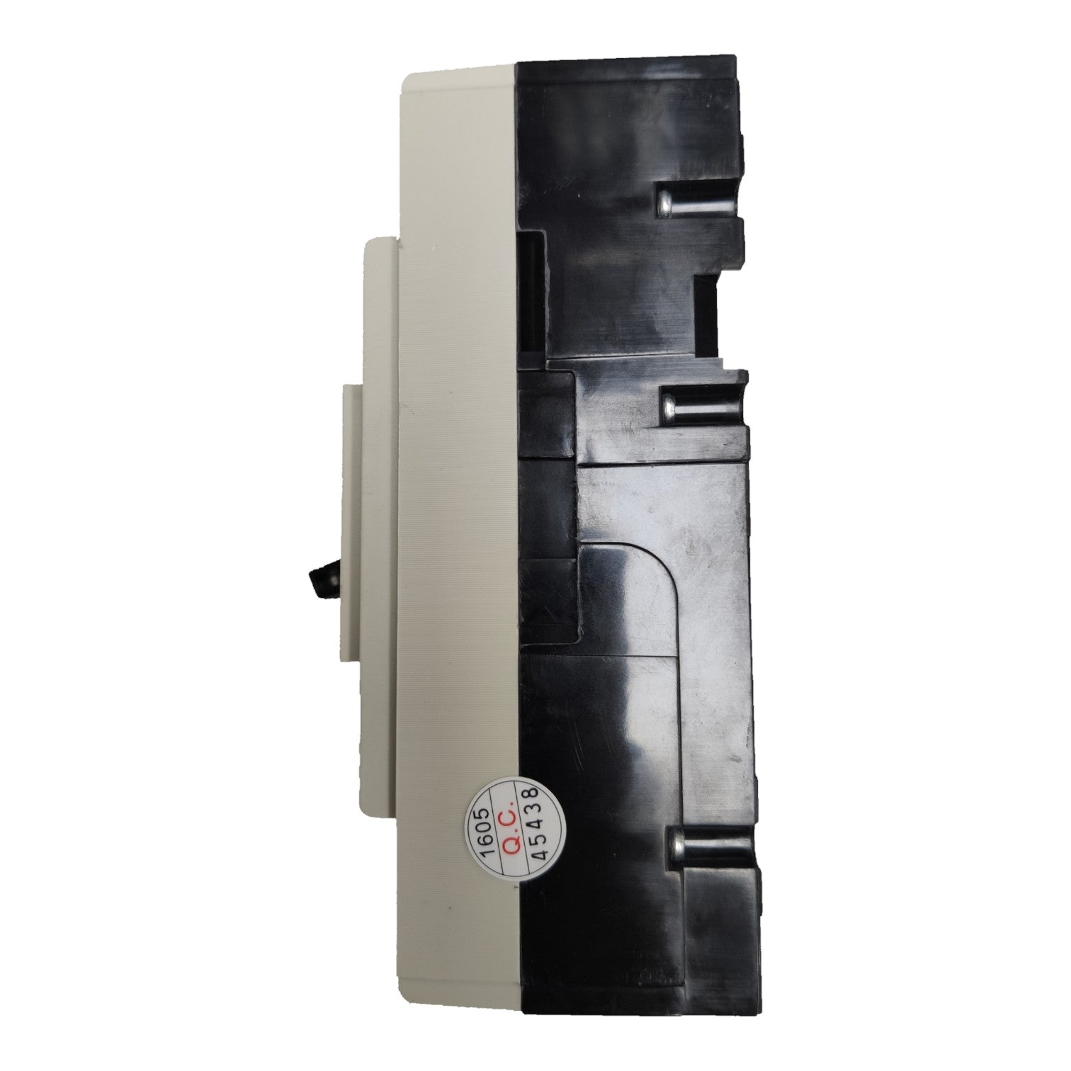 A vintage industrial electrical contactor or relay component, featuring a dual-color design of black plastic and beige/cream plastic, with a small circular sticker on the front.
