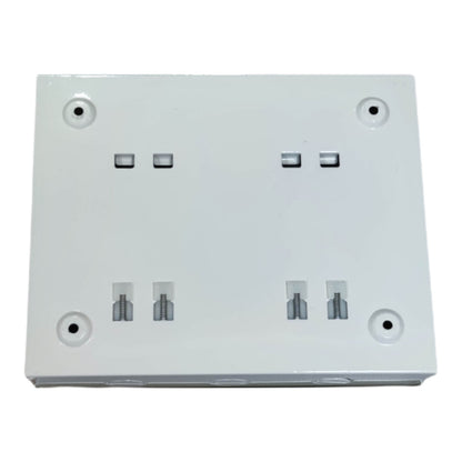 White electrical wall plate with multiple sockets on a white background