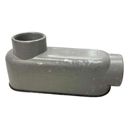 Gray plastic pipe fitting on a white background