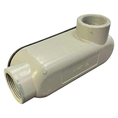 White plastic plumbing fitting with threaded ends on a white background