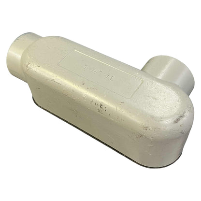 Beige metal pipe fitting on a white background