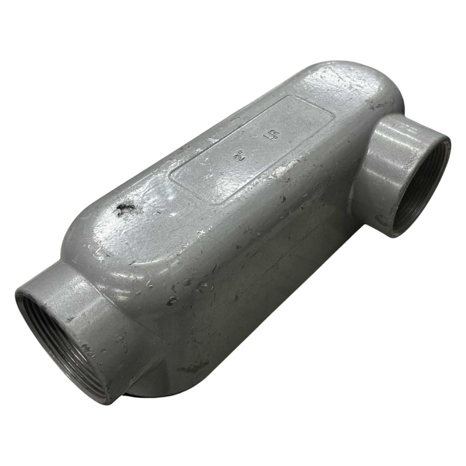 Gray metal pipe fitting on a white background