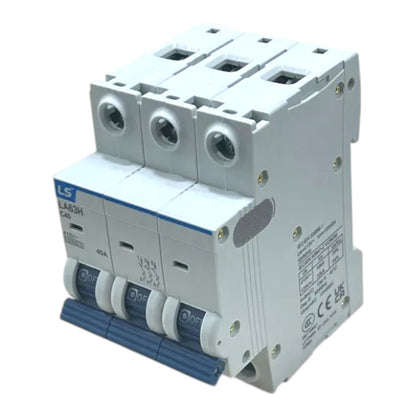 A three-phase 4-pole modular electrical circuit breaker, model LA63H C20, featuring a white plastic housing with blue accents on the switch levers and brand label.