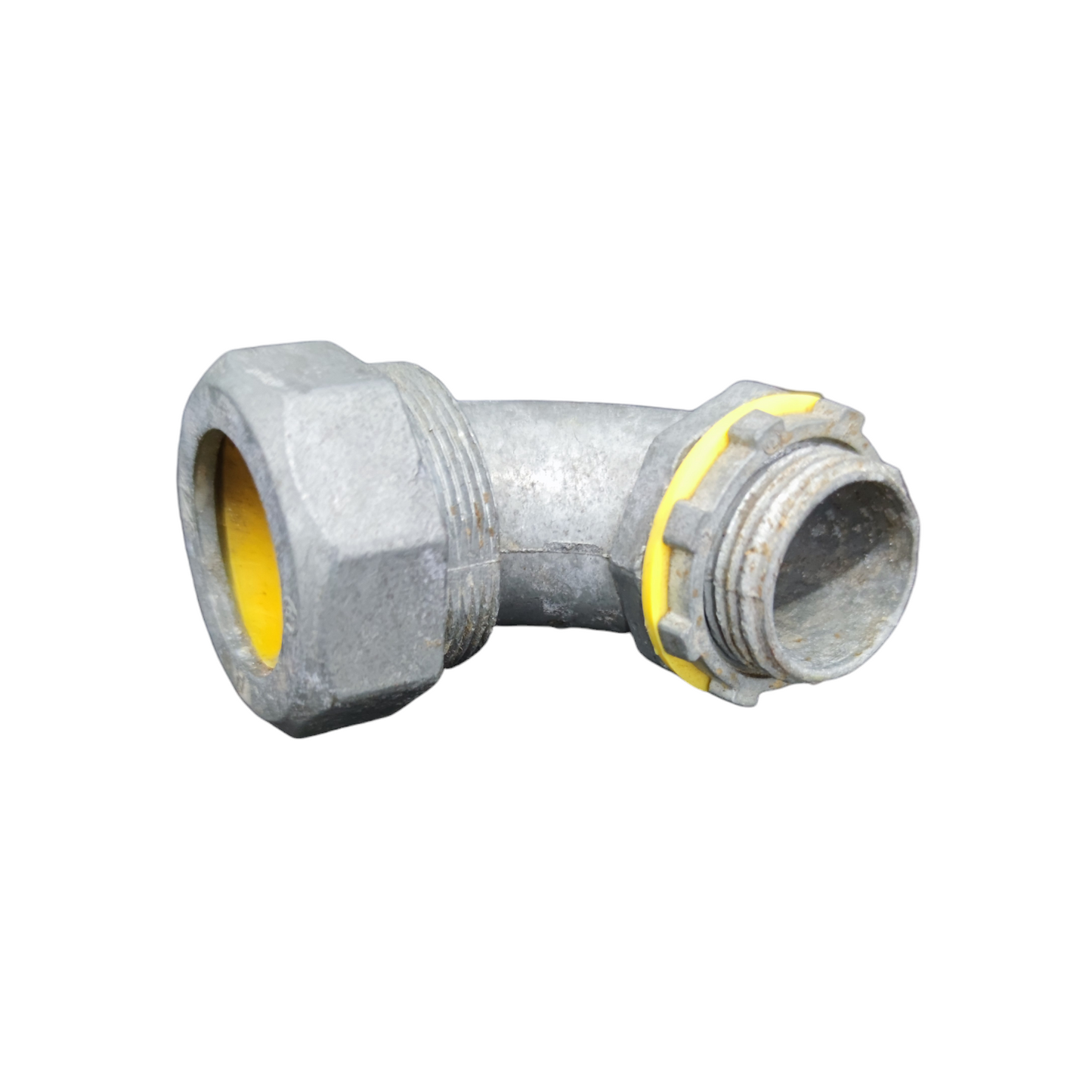 Metal pipe fitting with yellow interior on a white background