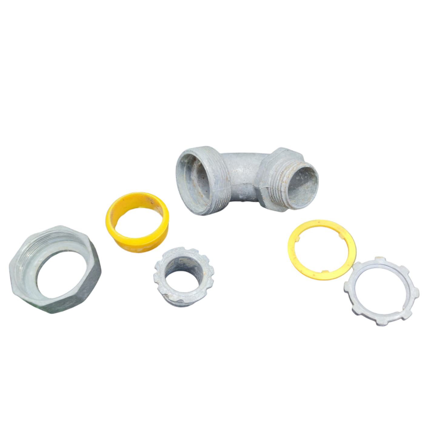 PVC plumbing fittings and washers on a white background