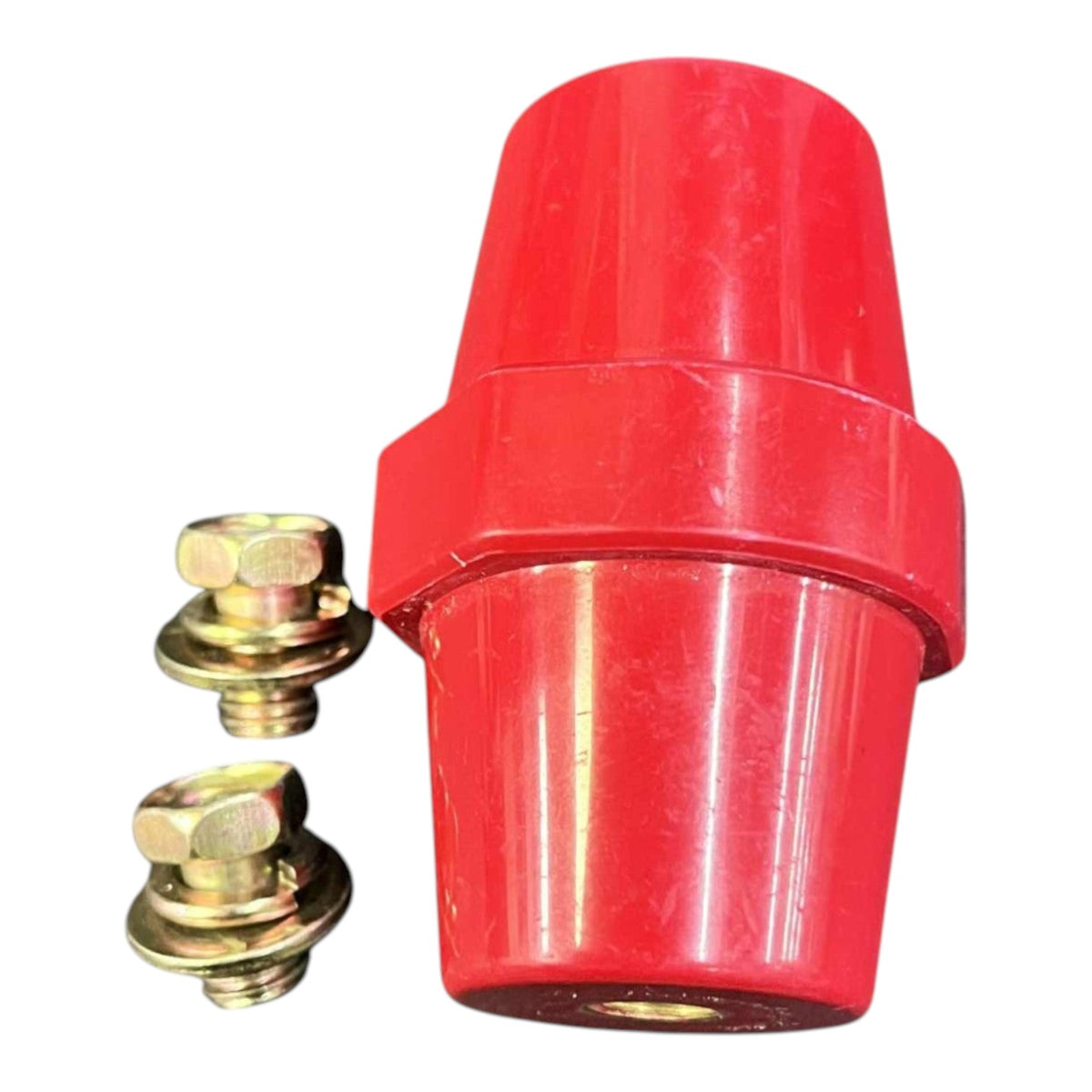 Red plastic fitting with two gold bolts on a white background