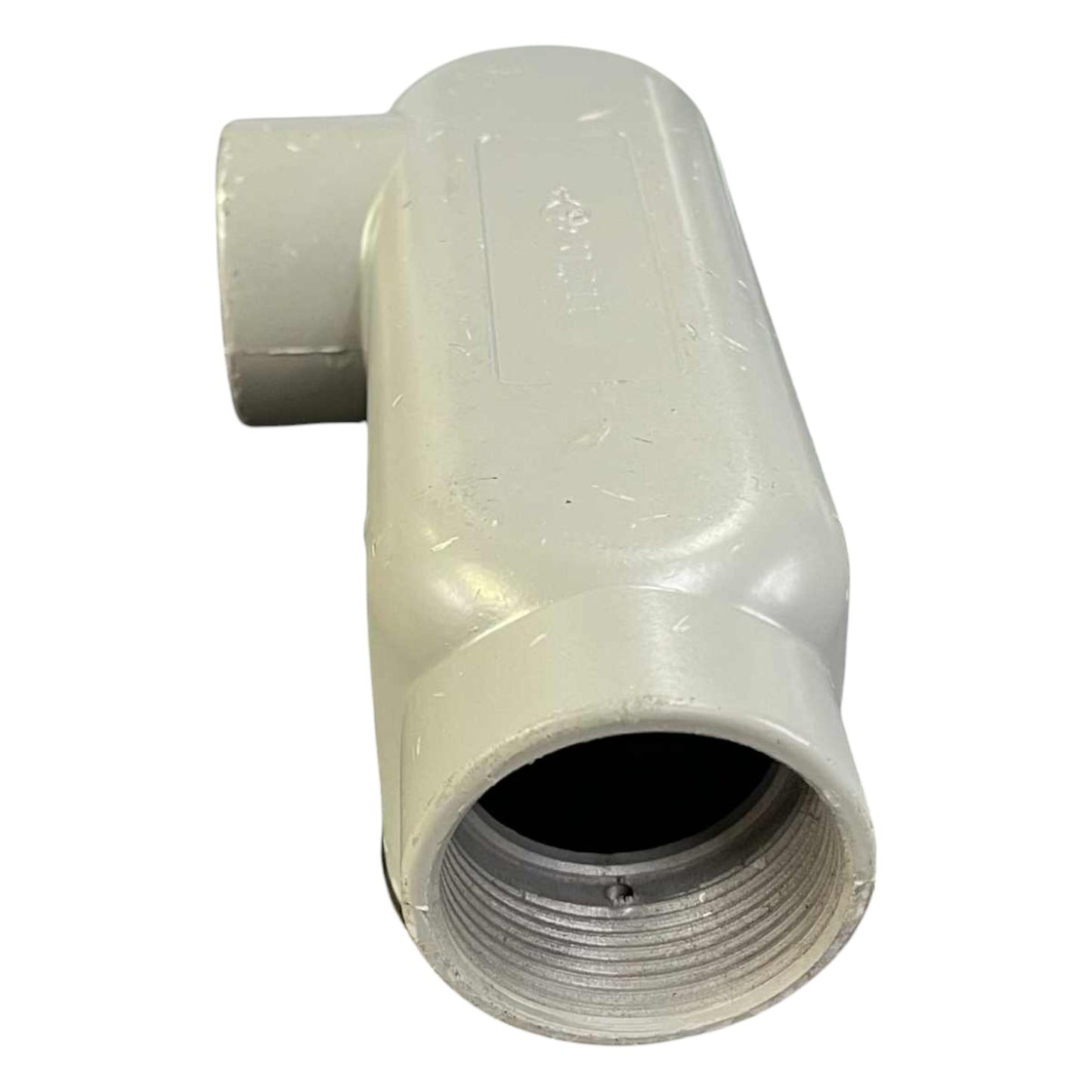 White plastic pipe fitting on a white background