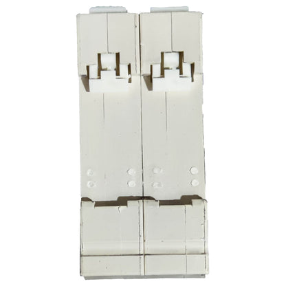 White plastic component with multiple holes and slots on a white background