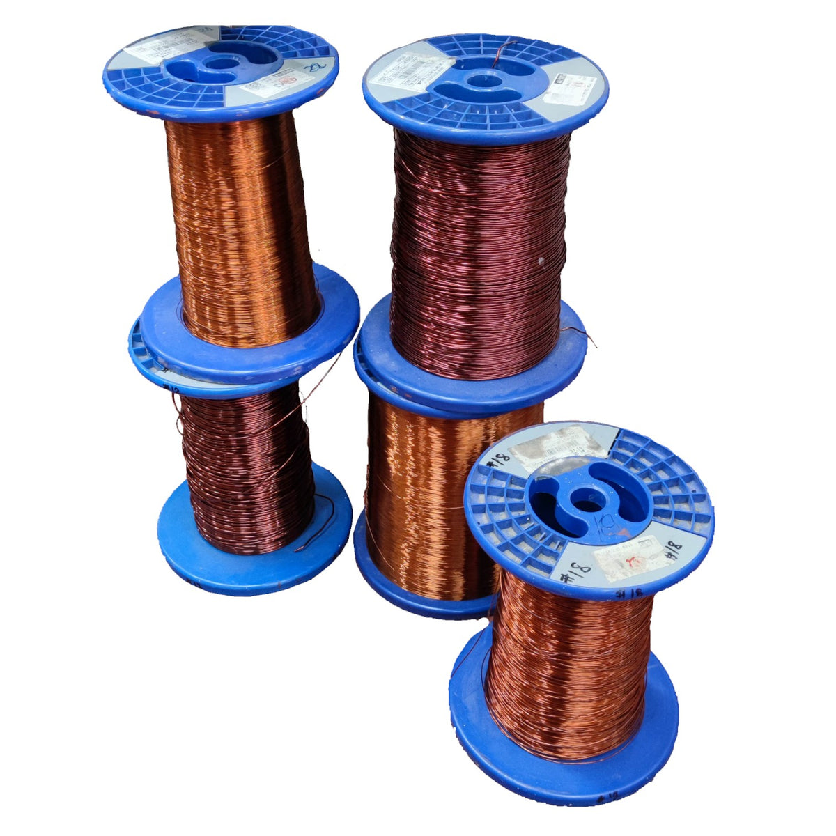 Four spools of copper wire stacked on blue plastic reels against a plain white background.