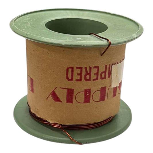 A spool of copper wire wound around a brown cardboard core with green plastic end caps, photographed on a white background.