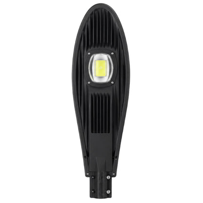 A modern black LED street light with a ribbed housing and a central square yellow LED chip under a clear lens, shown against a plain white background.
