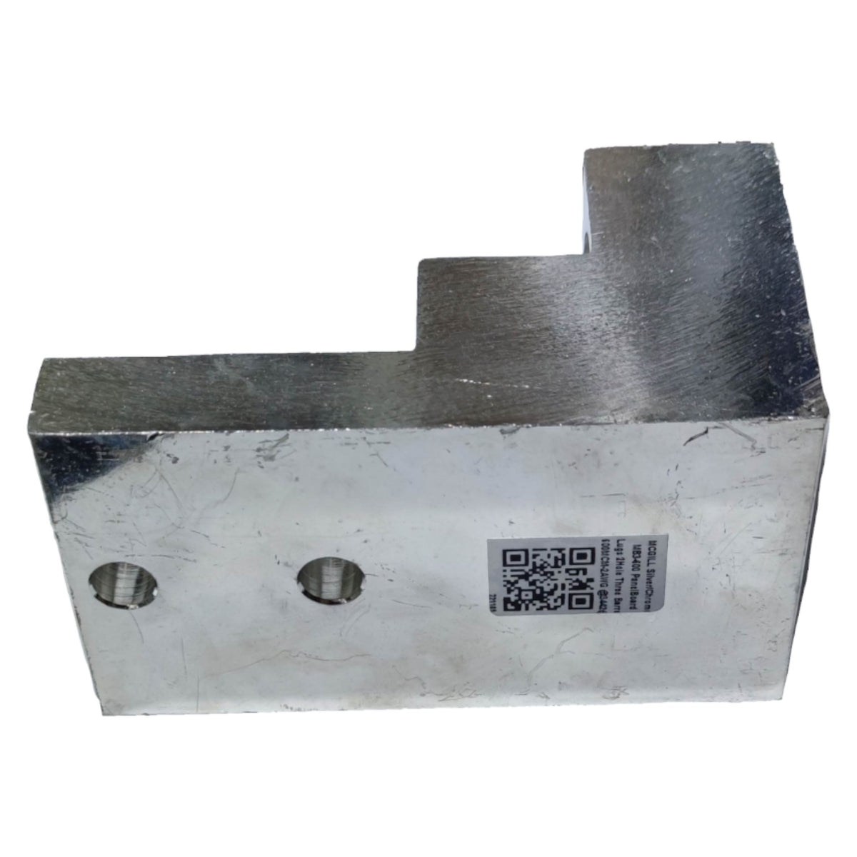 Metal block with a QR code label on a white background